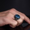 МУЖСКОЕ СЕРЕБРЯНОЕ КОЛЬЦО 925 ПРОБЫ С ОВАЛЬНЫМ ГОЛУБЫМ ТОПАЗОМ